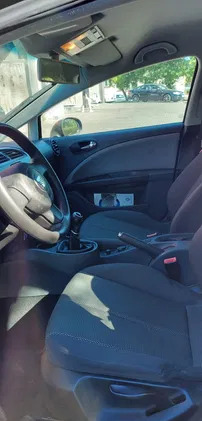 samochody osobowe Seat Leon cena 16500 przebieg: 142000, rok produkcji 2009 z Głogów